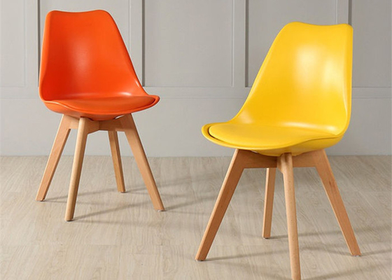 High-quality modern colorful plastic tulip dining chair with beech wood legs, suitable for dining room and living room